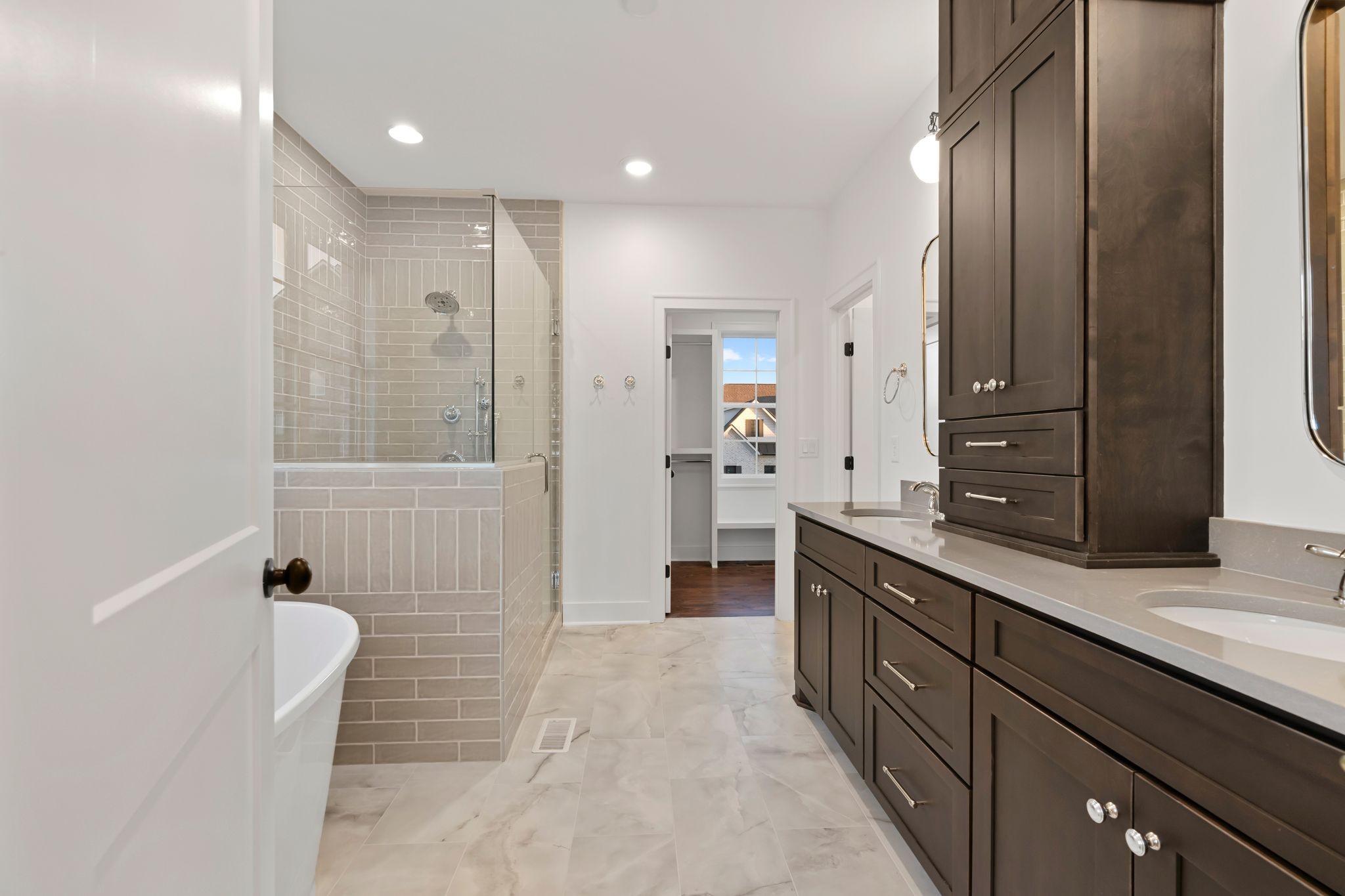307 Oak Street Lebanon, TN 37087 - Photo 28 of 46 a spacious bathroom with a double vanity sink a large mirror and shower