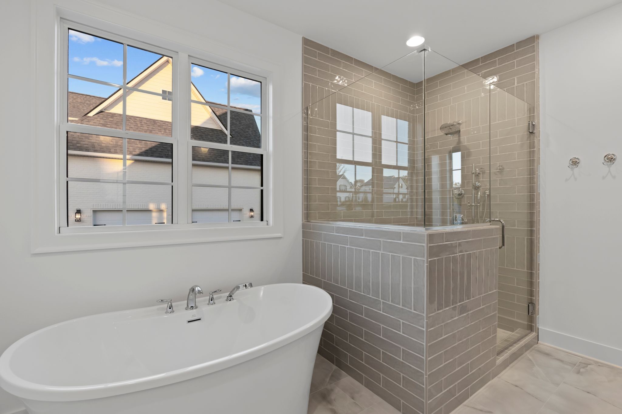 307 Oak Street Lebanon, TN 37087 - Photo 31 of 46 a bathroom with a bathtub a shower and a window