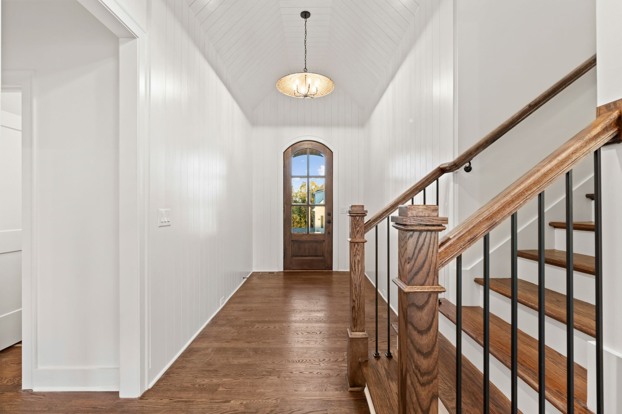 307 Oak Street Lebanon, TN 37087 - Photo 6 of 46 a view of staircase with railing and a chandelier