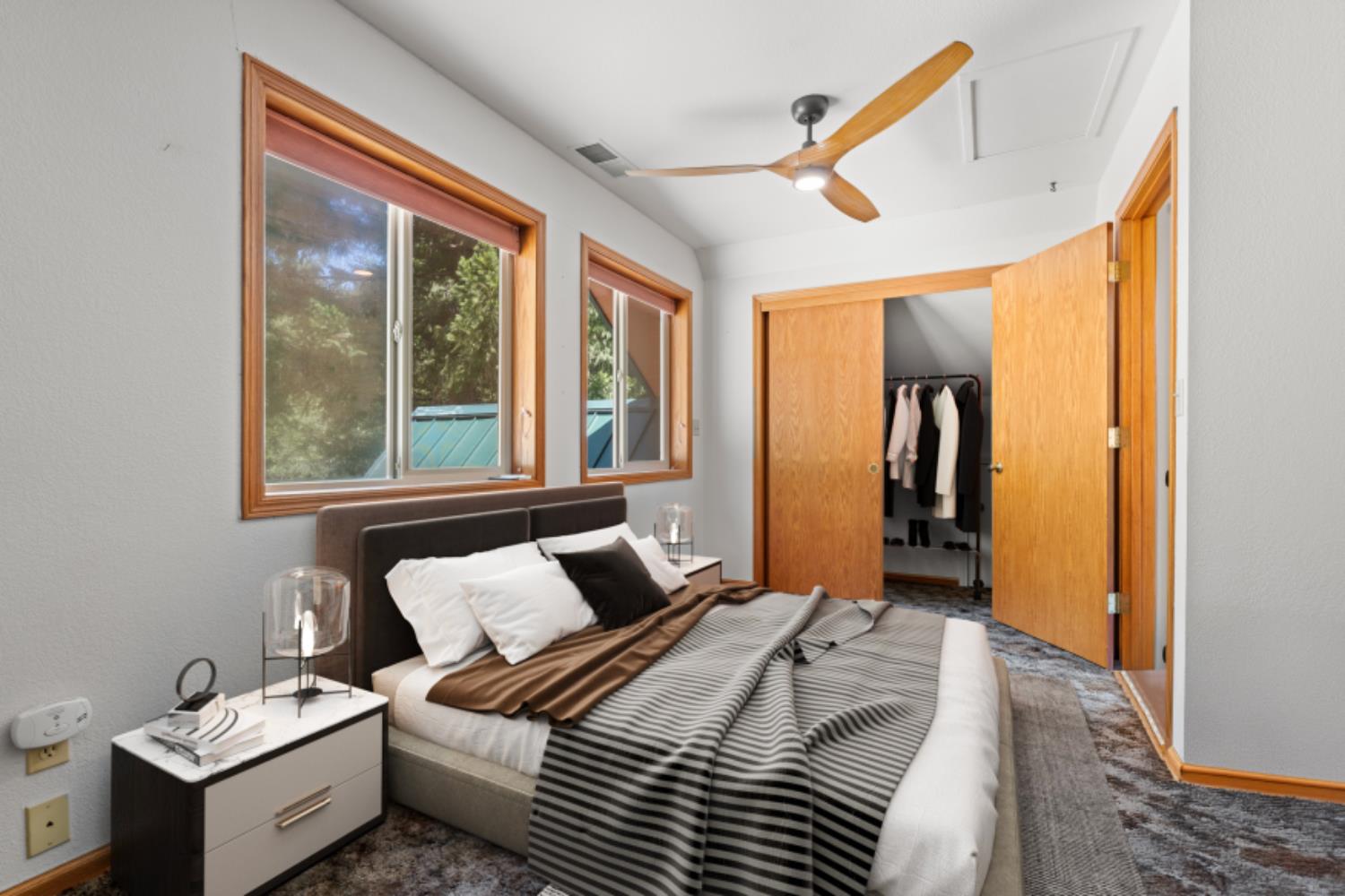 200 Craycroft Ridge Road Downieville, CA 95936 - Photo 16 of 34 a bedroom with a bed and a large window