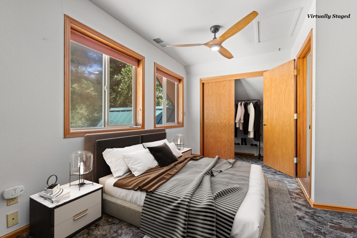 200 Craycroft Ridge Road Downieville, CA 95936 - Photo 18 of 39 a bedroom with a bed and a large window