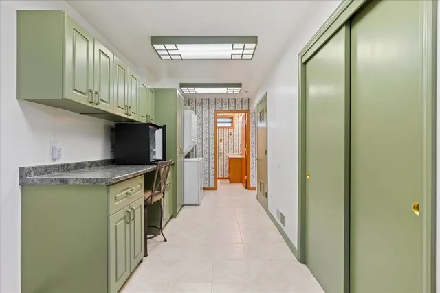 a view of a house with backyard and porch