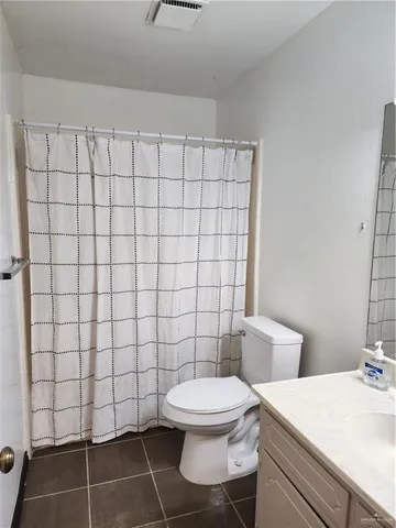 a bathroom with a toilet and a sink