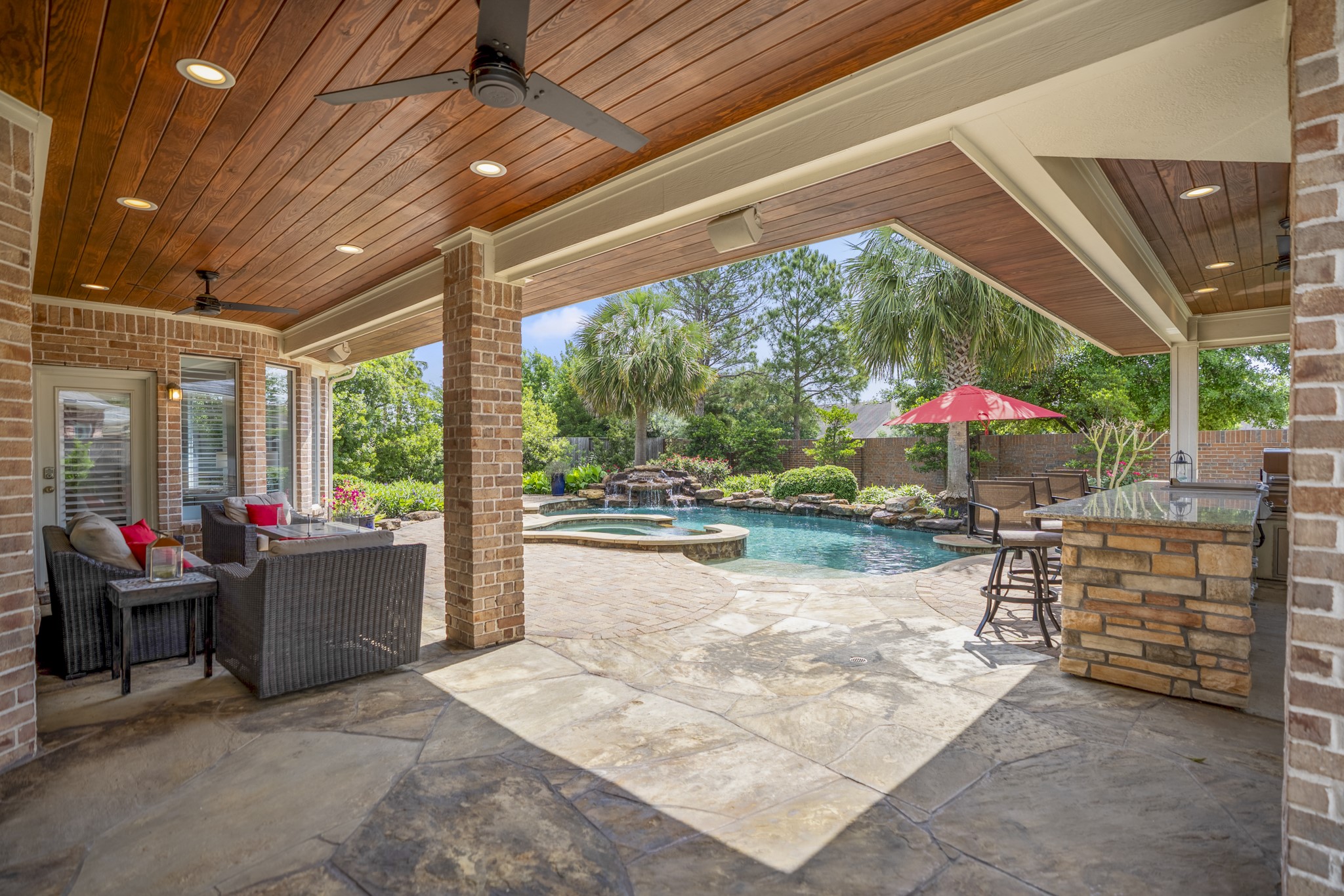 9707 Blue Cruls Way Spring, TX 77379 - Photo 42 of 50 a view of a patio with a table chairs and a backyard