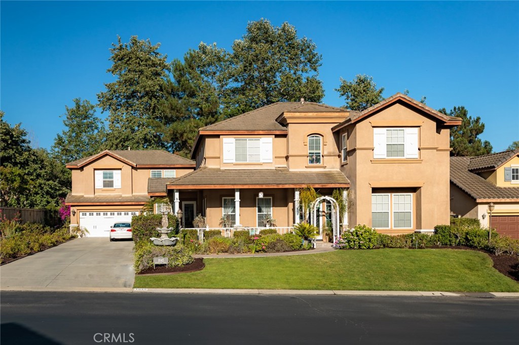 1045 Inverlochy Drive Fallbrook, CA 92028 - Photo 1 of 39 a front view of a house with a garden and yard
