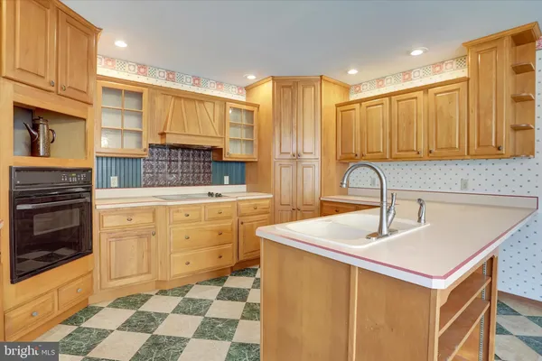 a kitchen with sink cabinets and stove