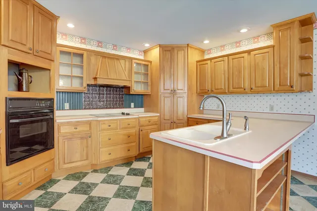 a kitchen with sink cabinets and stove