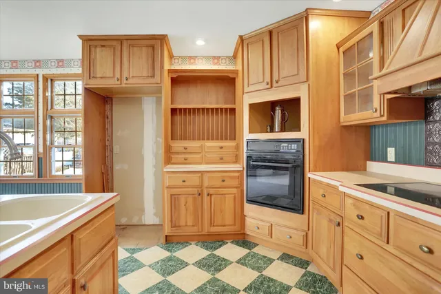 a living room filled with furniture and a chandelier