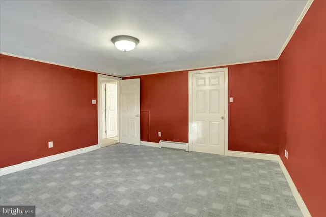 an empty room with closet area