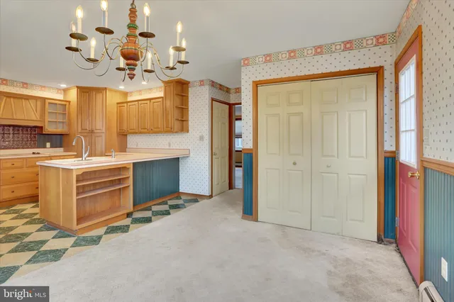 a kitchen with stainless steel appliances a sink and a refrigerator