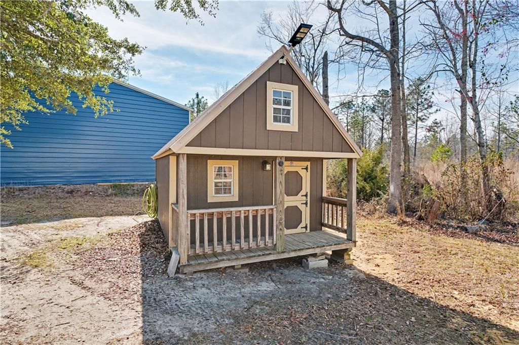 1833 Tom Odum Road Vidalia, GA 30474 - Photo 52 of 59 a view of a small yard and wooden fence