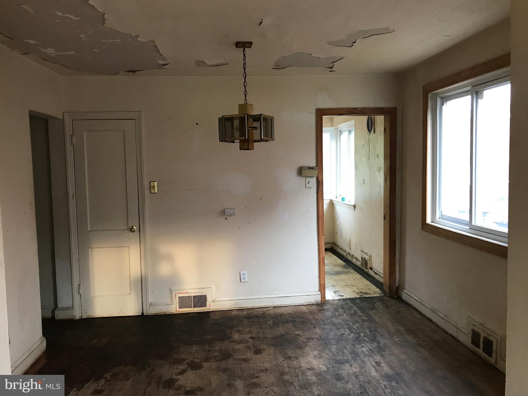 5051 Sargent Road Northeast Washington, DC 20017 - Photo 4 of 11 an empty room with windows