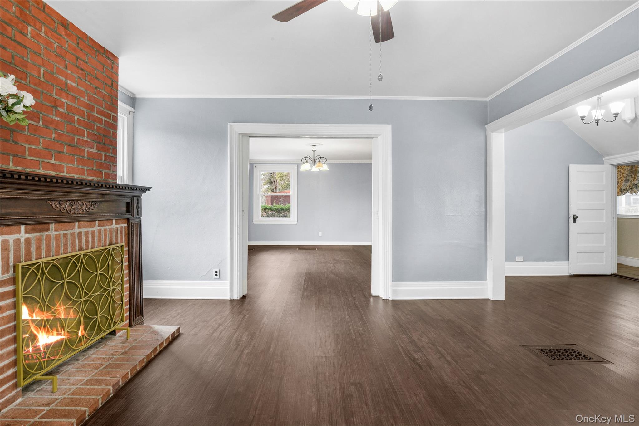 8 The Serpentine New Rochelle, NY 10801 - Photo 13 of 48 wooden floor in an empty room with a fireplace
