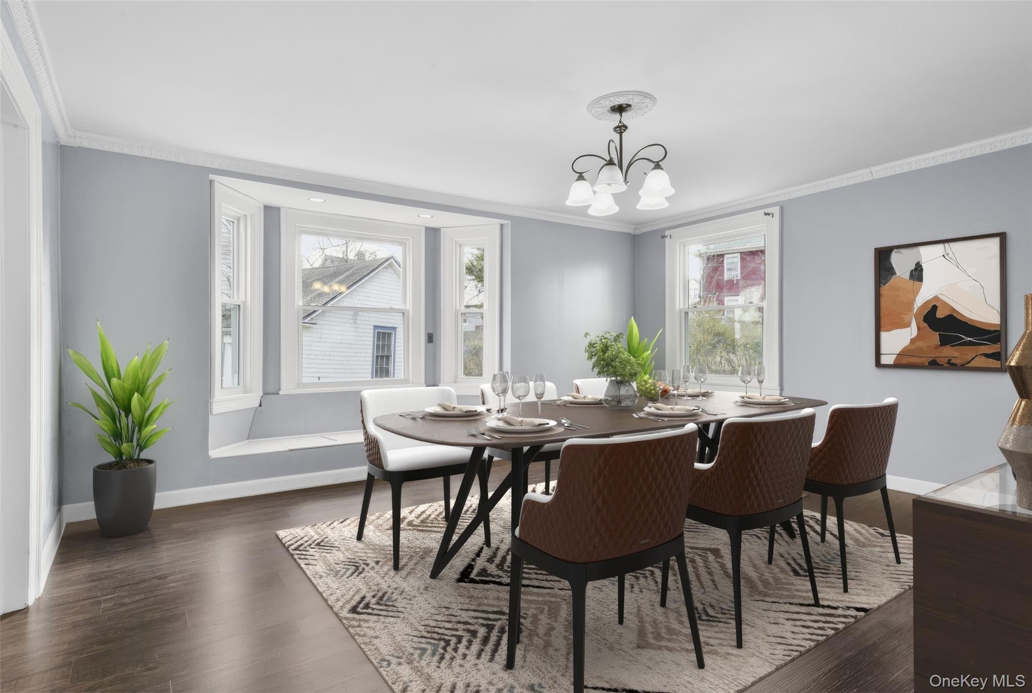 8 The Serpentine New Rochelle, NY 10801 - Photo 18 of 48 a view of a dining room with furniture window and wooden floor