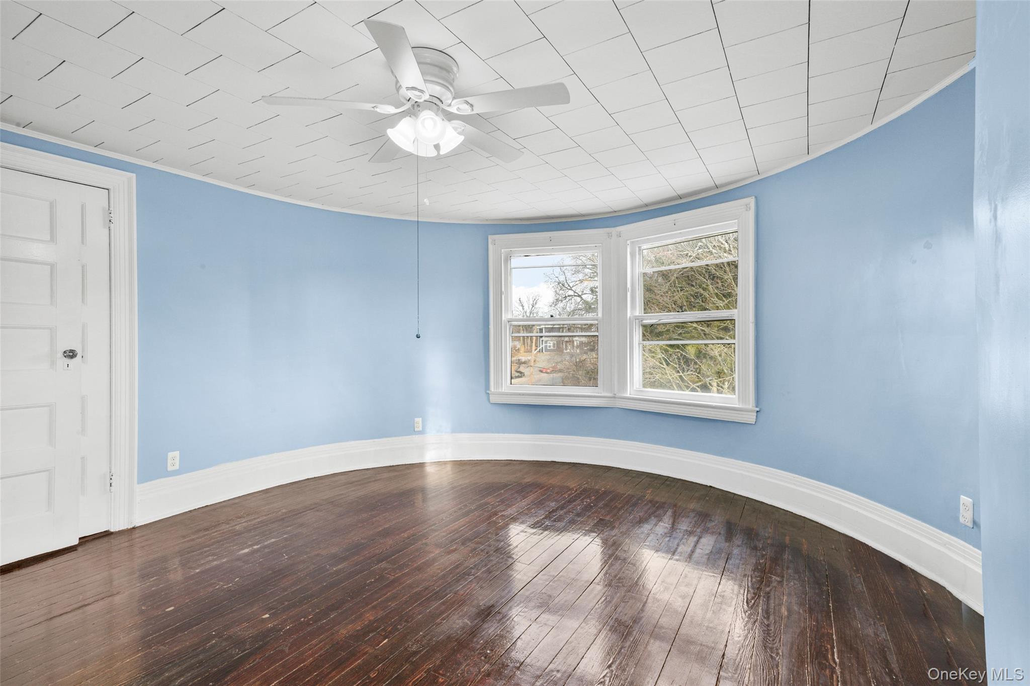 8 The Serpentine New Rochelle, NY 10801 - Photo 24 of 48 wooden floor in an empty room with a window
