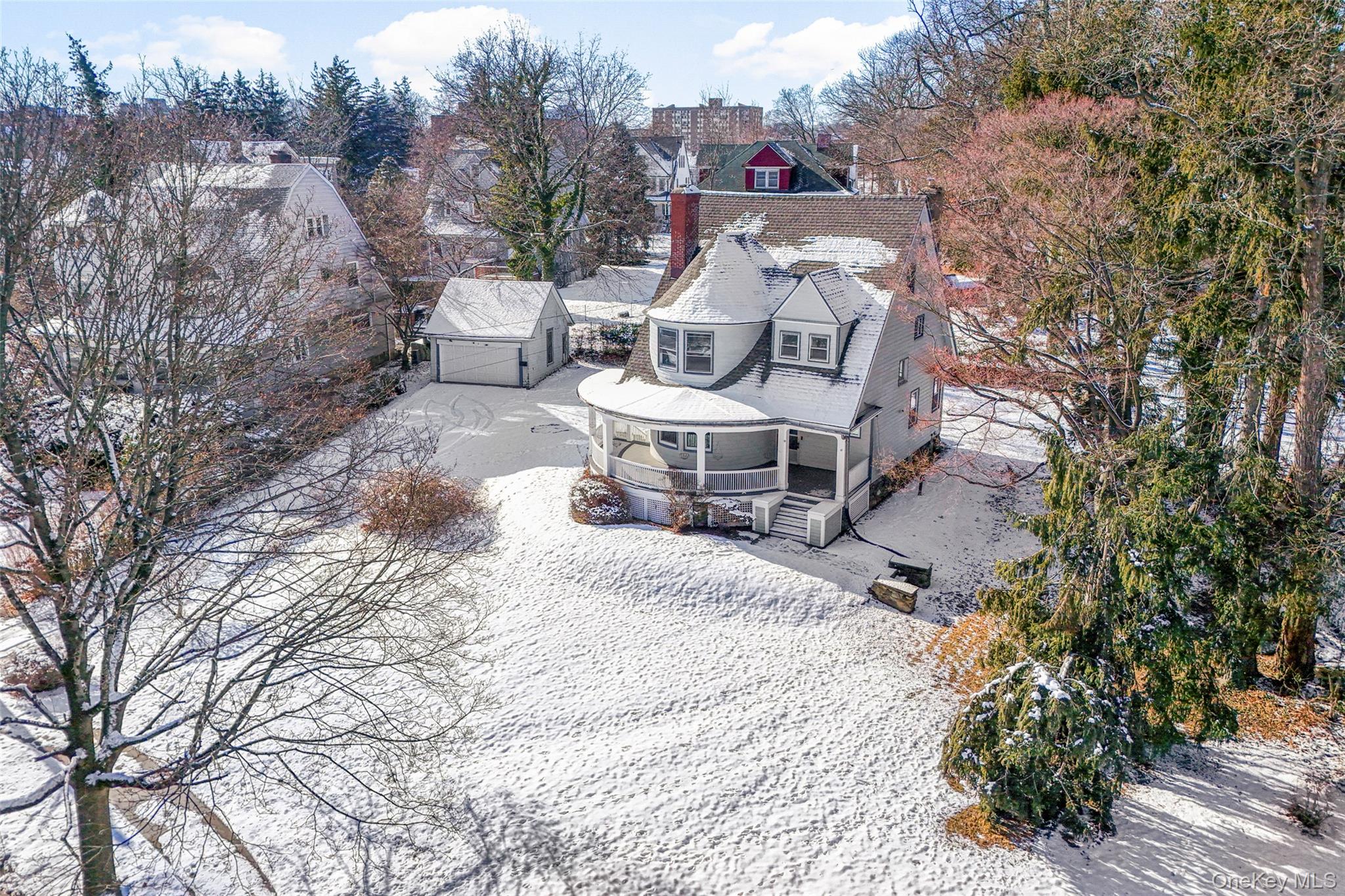8 The Serpentine New Rochelle, NY 10801 - Photo 41 of 48 a wooden bench sitting in middle of a yard