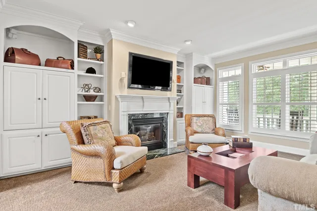 a dining room with furniture and a chandelier