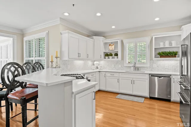 a kitchen with a sink stove and refrigerator