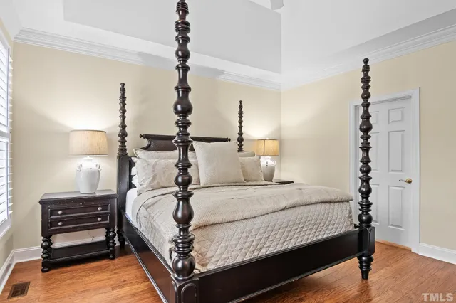 a bathroom with a double vanity sink mirror and bathtub