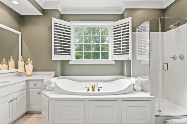 a bathroom with a toilet a sink and a mirror