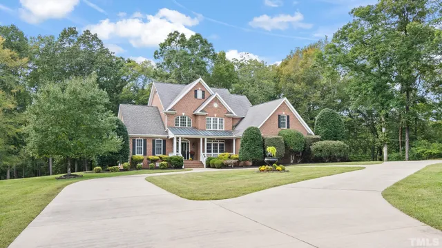 a view of a chairs and table in the balcony
