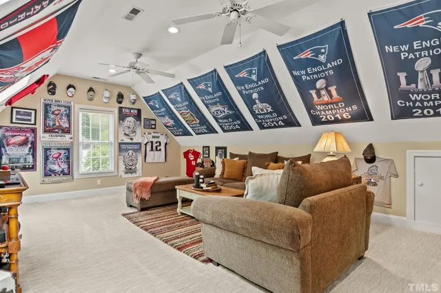 a spacious bedroom with a bed and a window