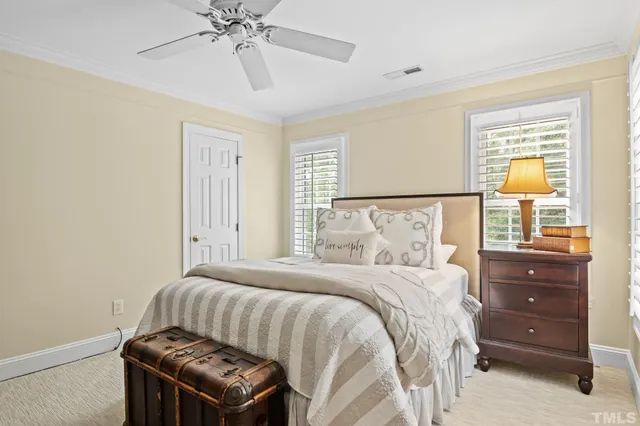 a bedroom with a bed and chair