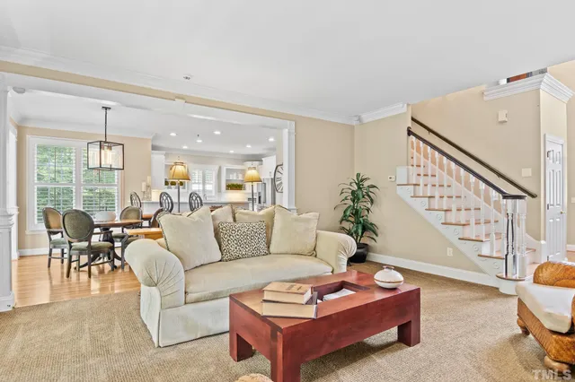 a living room with furniture fireplace and a flat screen tv