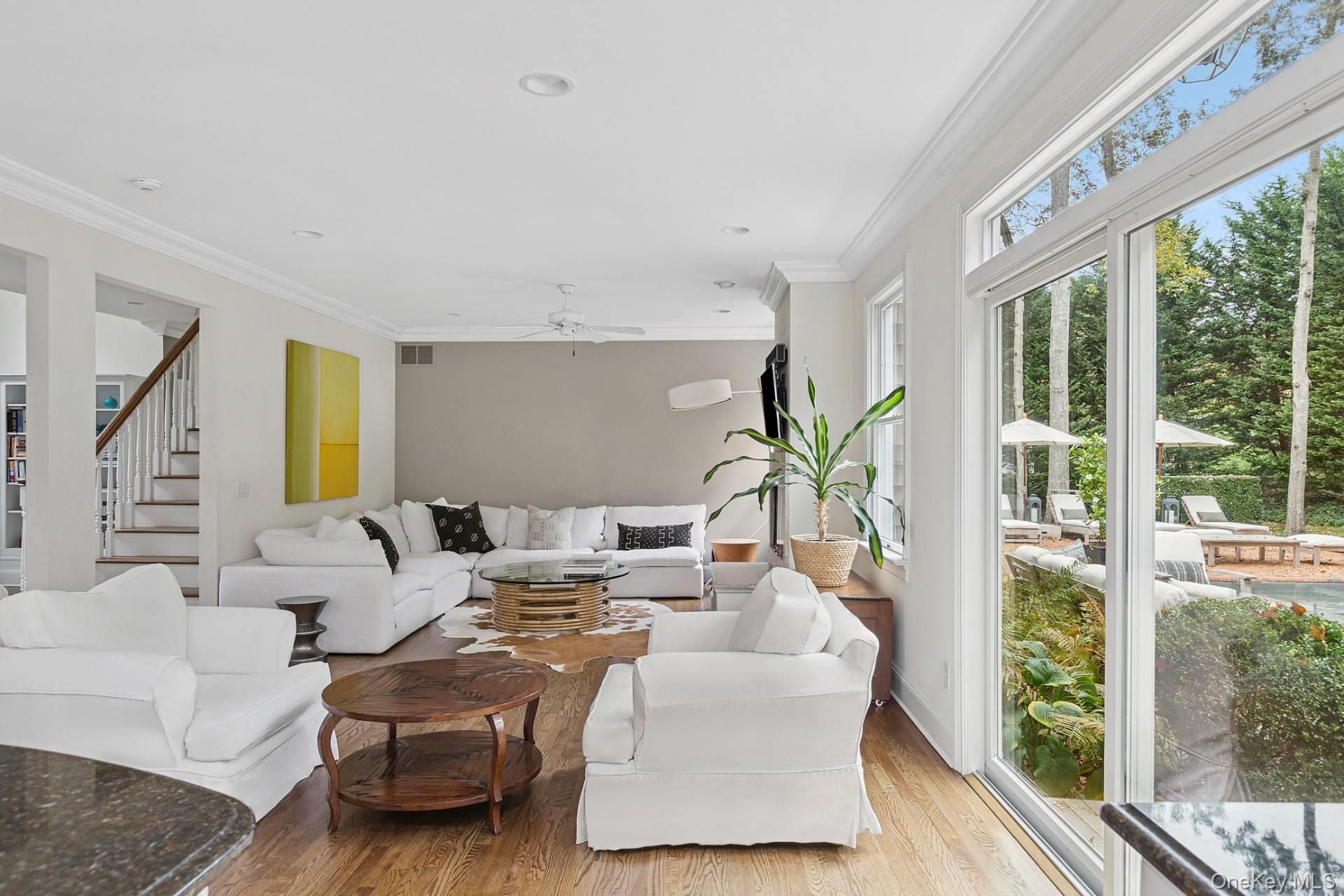 10 Bayview Road Southampton, NY 11968 - Photo 14 of 39 a living room with furniture and large windows