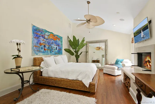 a bedroom with a bed furniture and a chandelier
