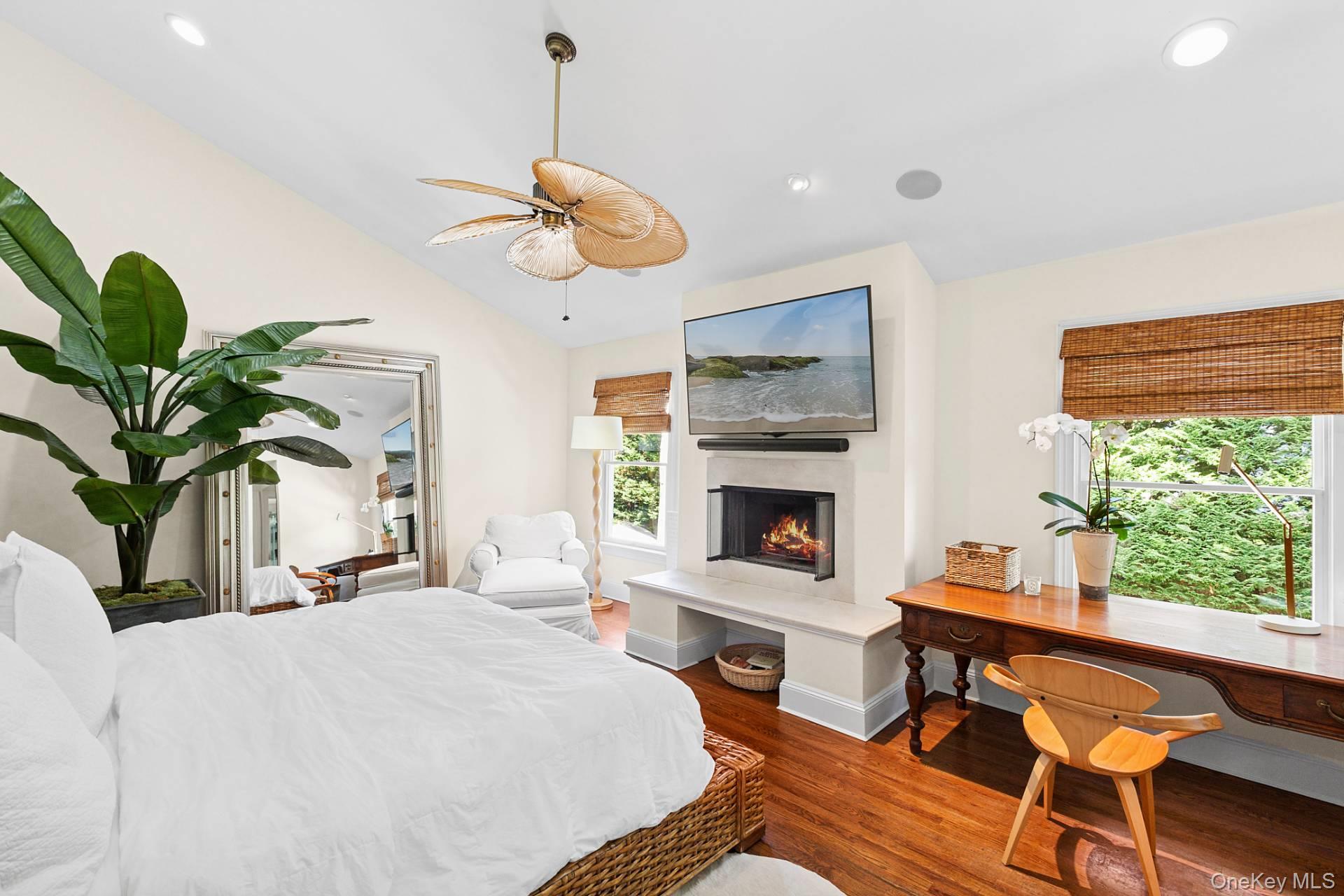 10 Bayview Road Southampton, NY 11968 - Photo 18 of 39 a dining room with furniture potted plants and wooden floor