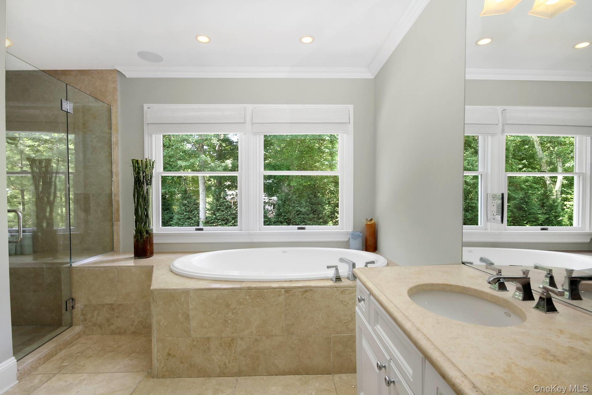 10 Bayview Road Southampton, NY 11968 - Photo 19 of 39 a bath tub sitting in a bathroom next to a window