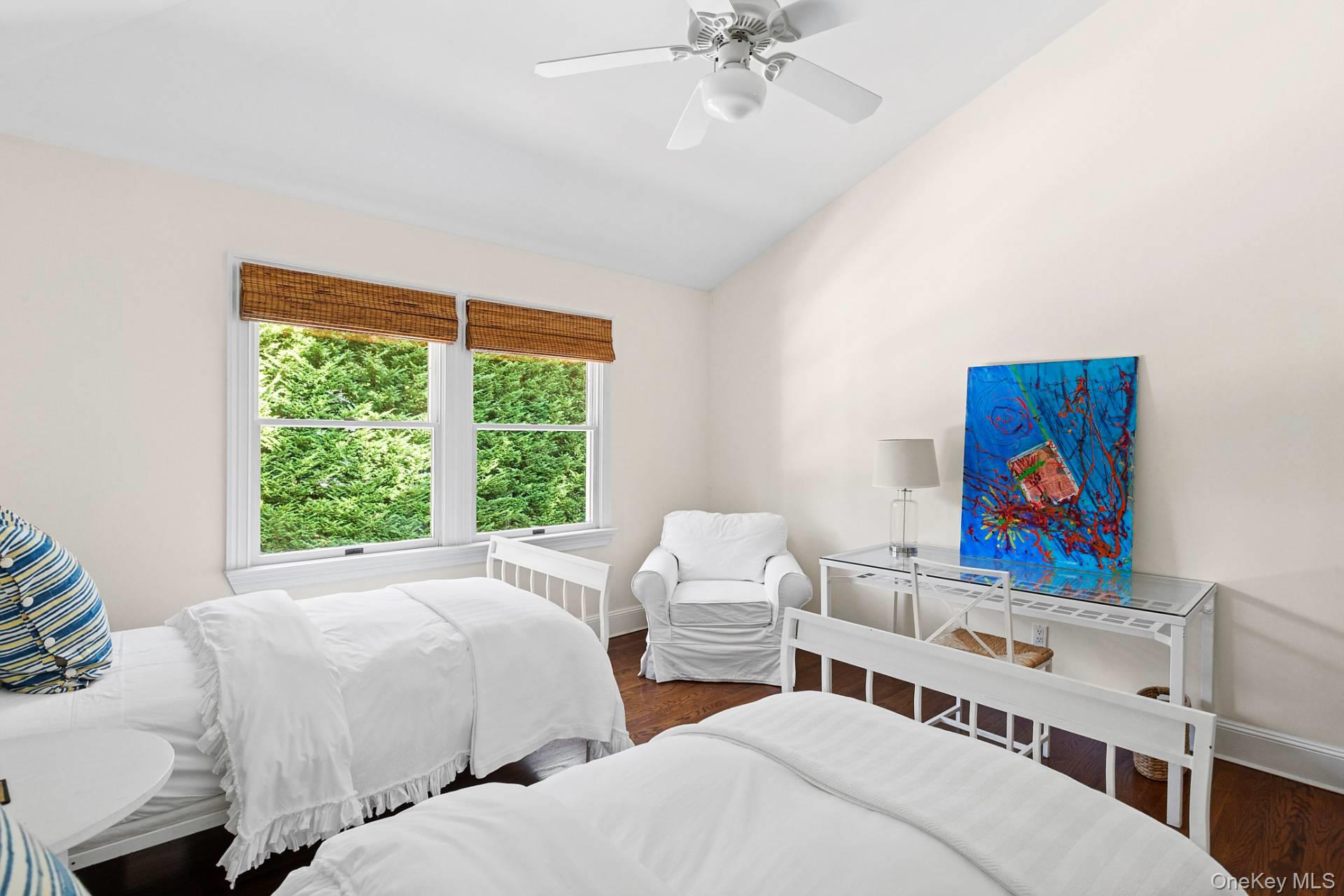 10 Bayview Road Southampton, NY 11968 - Photo 23 of 39 a bedroom with two beds and a painting on the wall