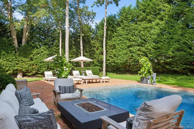 a front view of a house with patio and yard