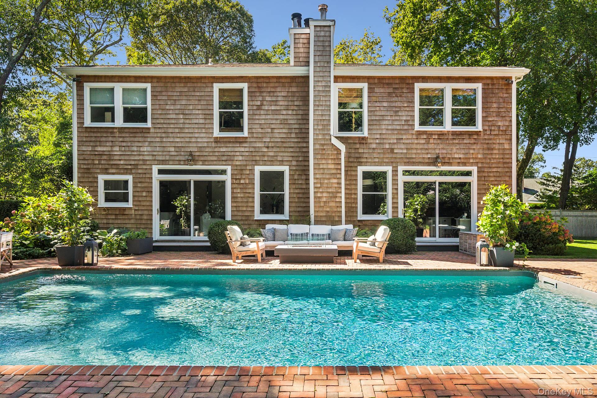 10 Bayview Road Southampton, NY 11968 - Photo 27 of 39 a front view of a house with patio and yard