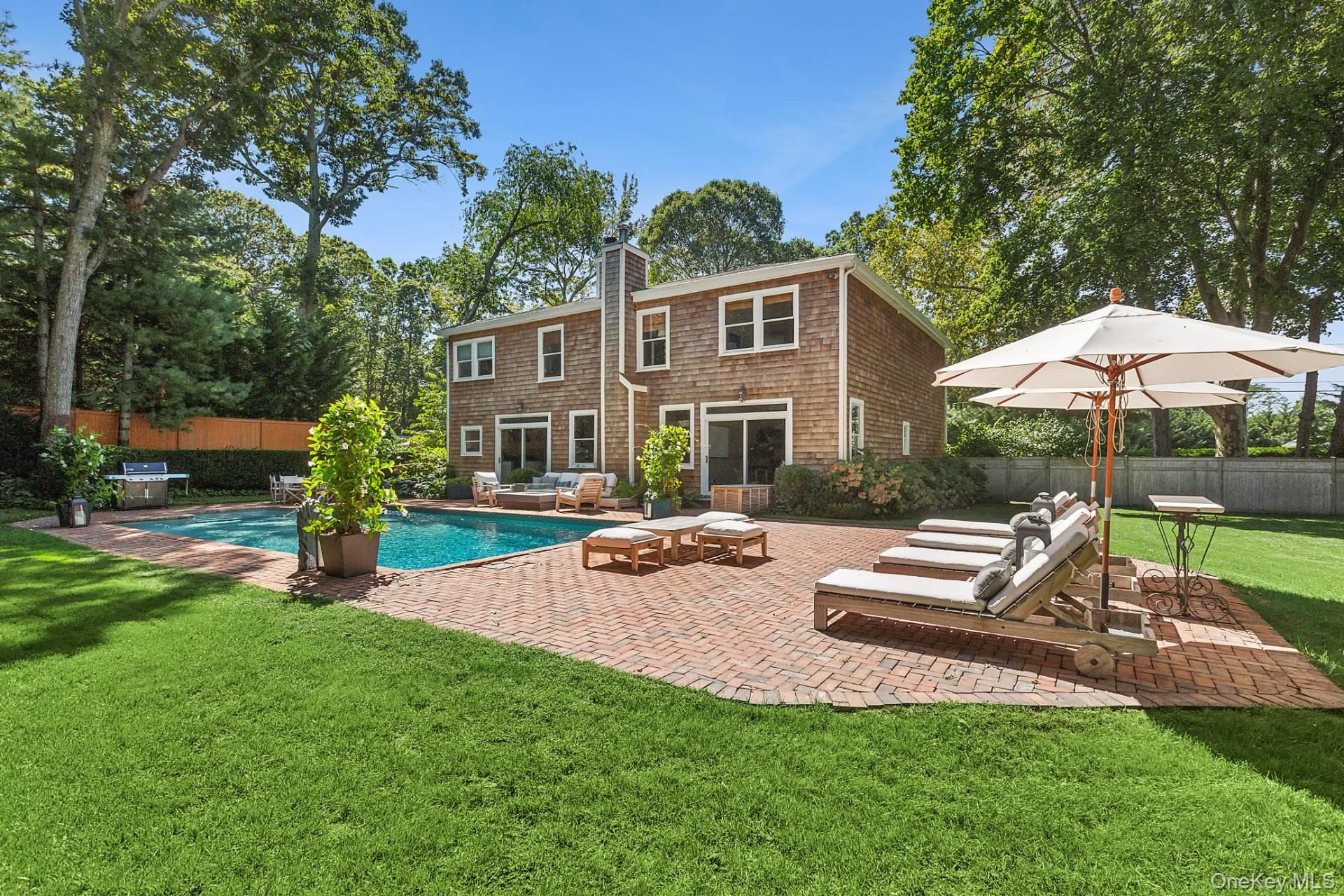 10 Bayview Road Southampton, NY 11968 - Photo 3 of 39 a view of a house with backyard sitting area and garden
