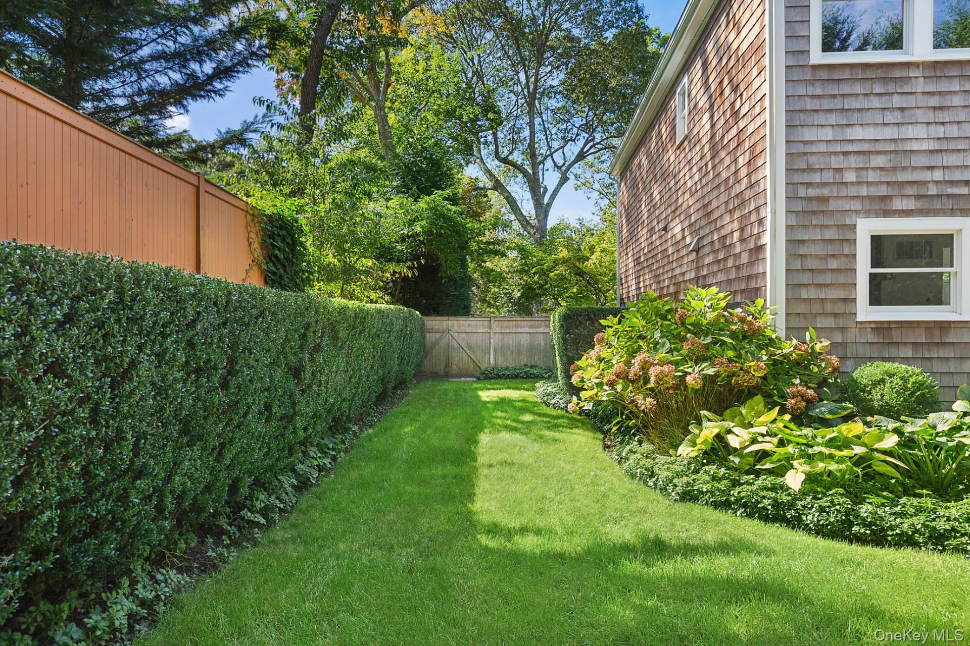 10 Bayview Road Southampton, NY 11968 - Photo 35 of 39 a view of a backyard with plants