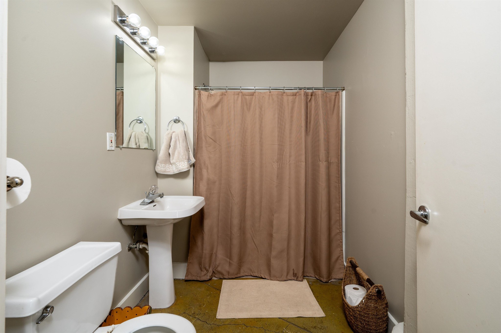 408 South Front Street, Unit 412 Memphis, TN 38103 - Photo 8 of 21 a bathroom with a sink toilet and shower