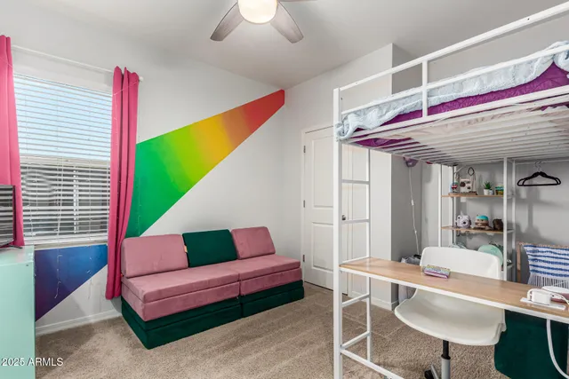 a living room with furniture and a chair