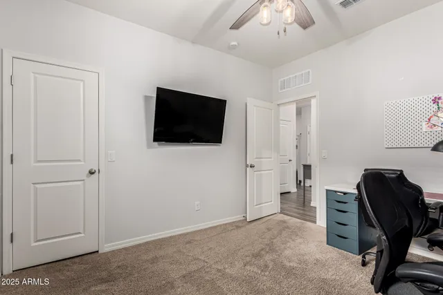 a view of a livingroom with a workspace