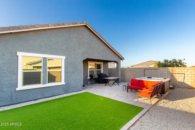 a backyard of a house with seating space