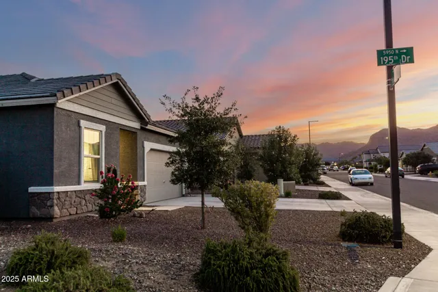 a front view of a house with sitting area