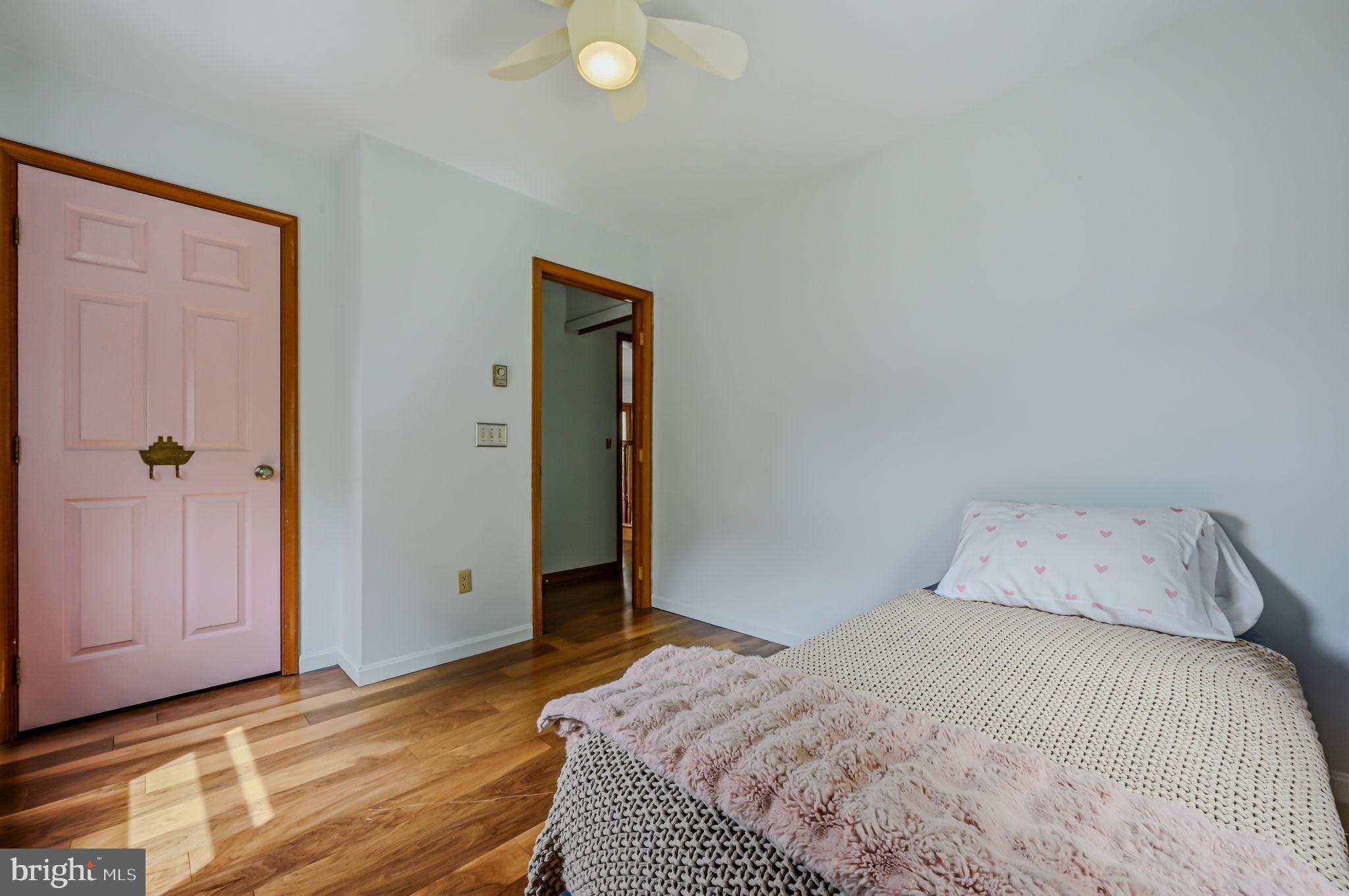 210 Elk View Road North East, MD 21901 - Photo 19 of 64 a bedroom with a bed and wooden floor