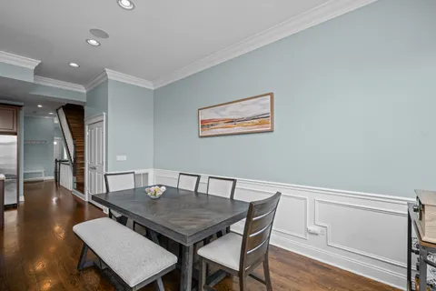 a living room with furniture a flat screen tv and a large window