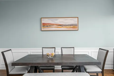 a kitchen with granite countertop a sink stainless steel appliances and cabinets