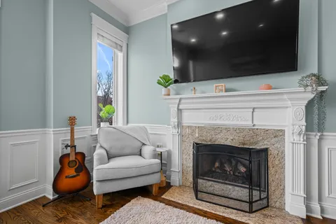 a bathroom with a granite countertop sink mirror vanity and toilet