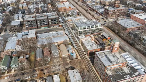 a view of a patio with dining table and chairs
