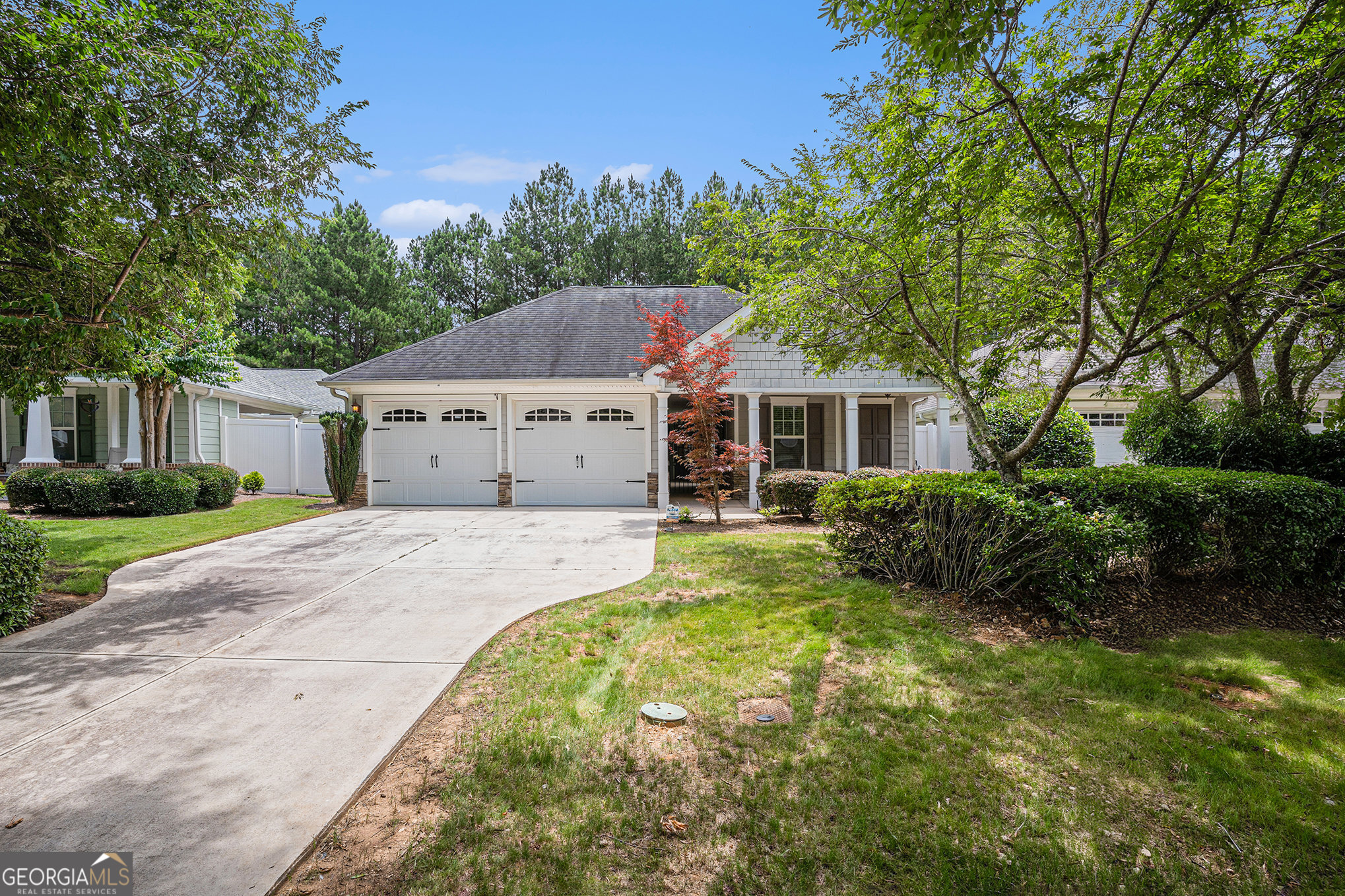 125 Cottage Club Drive Locust Grove, GA 30248 - Photo 1 of 1 a aerial view of a house with a yard and garage