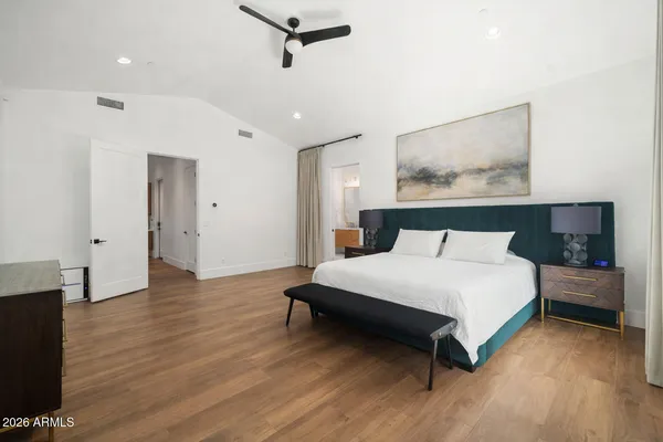 a en suite bathroom with a double vanity sink and a mirror
