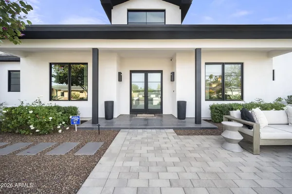 a view of an entryway with wooden floor and a rug